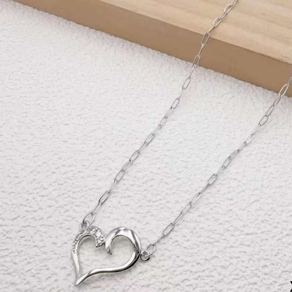Silver love necklace with stone embellished design