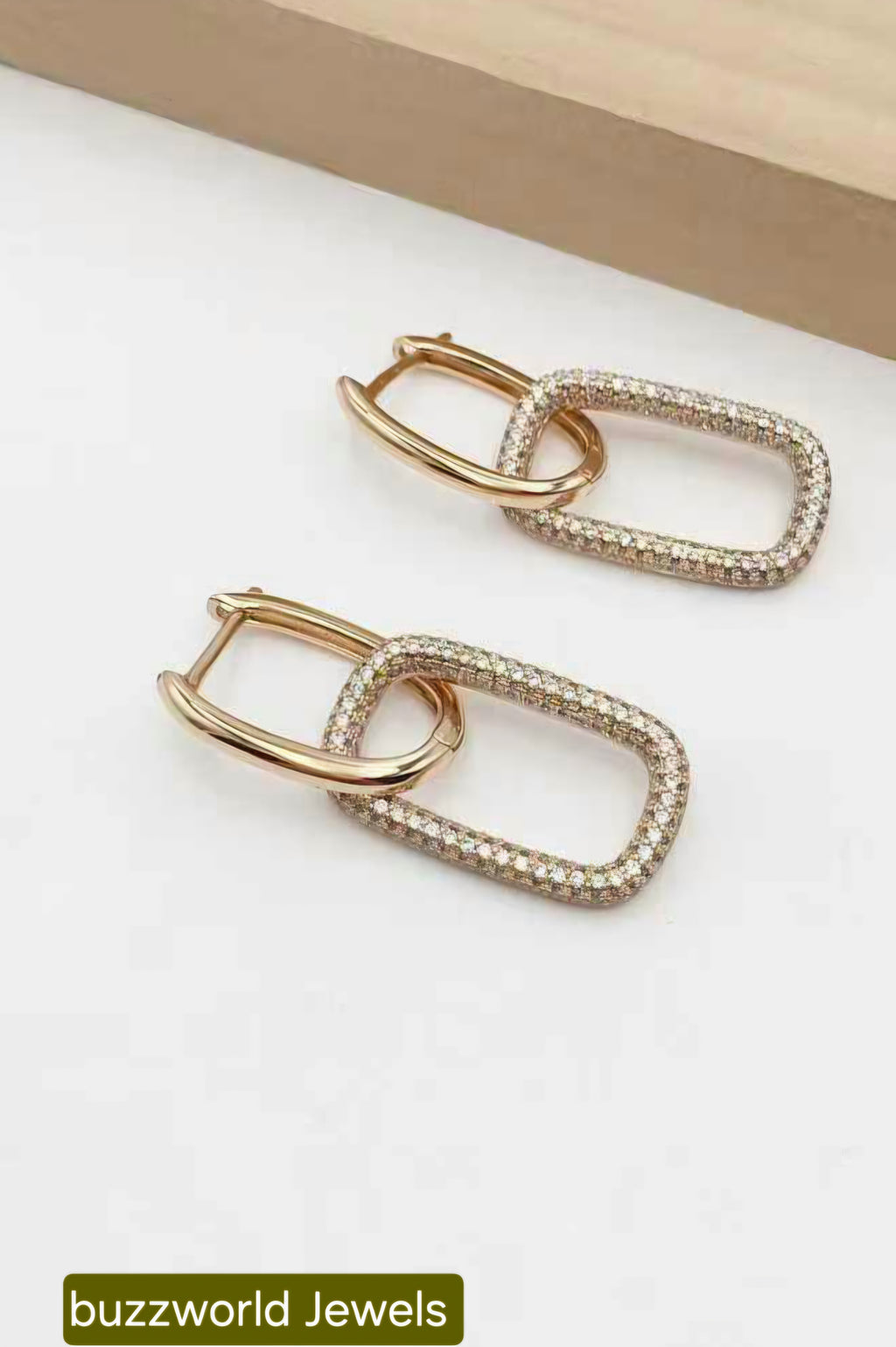 Double loop earings with stone and plain design